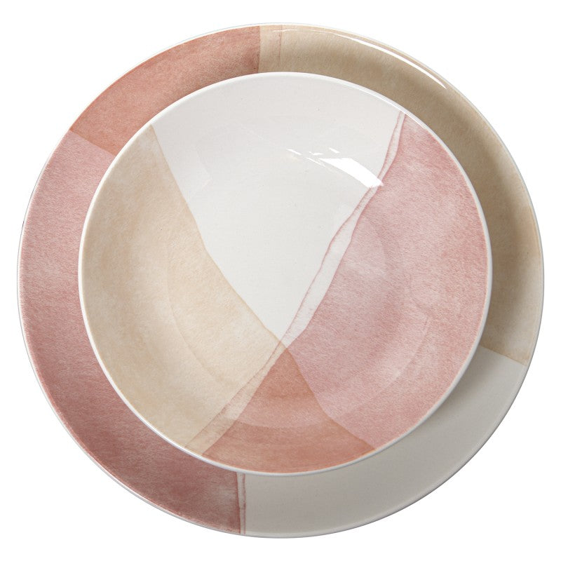 Vista superior de los platos de la vajilla de porcelana mostrando el detalle del diseño en tonos rosa, blanco y crema
