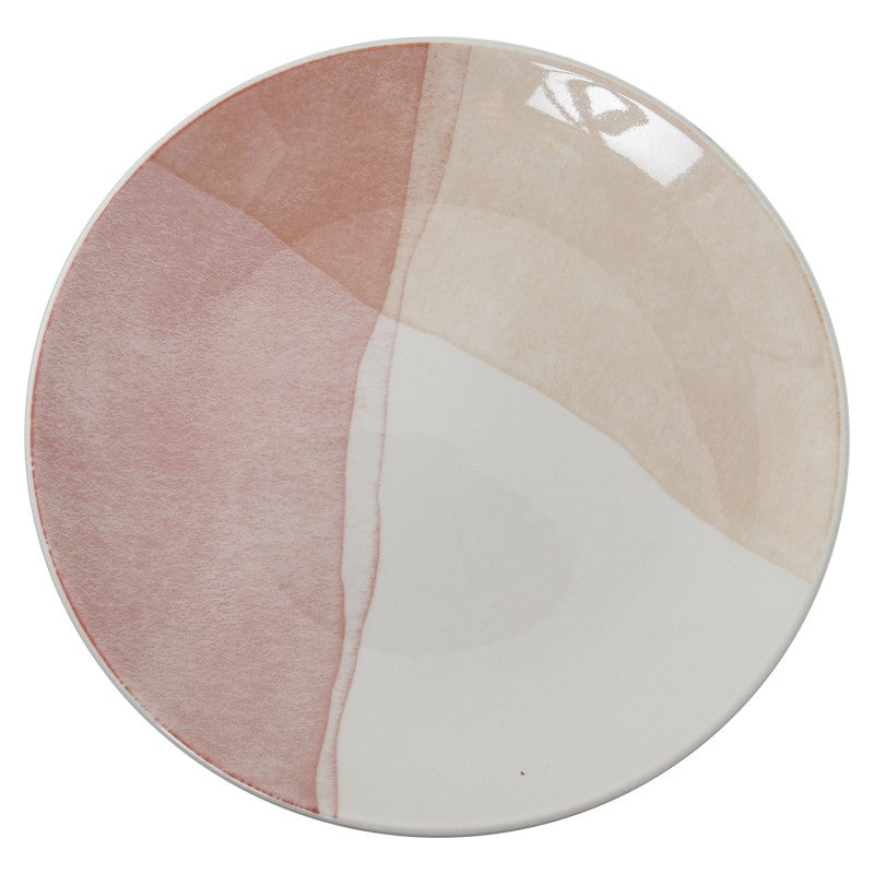 Vista superior del plato de cena de porcelana con diseño de bloques de color en tonos rosa, blanco y crema