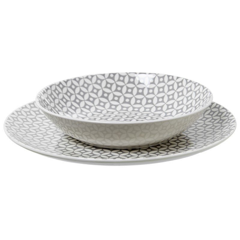 Tazón apilado sobre plato de cena de la vajilla de porcelana gris con estampado geométrico
