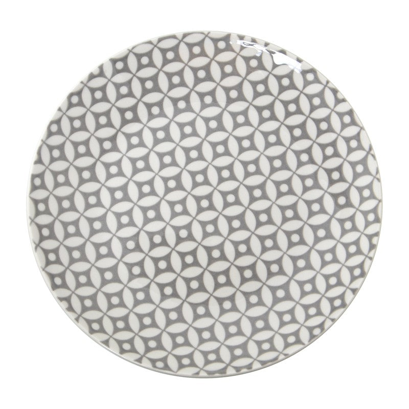 Vista superior del plato de cena de porcelana gris con estampado geométrico distribuido en toda la superficie