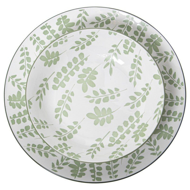 Vista superior del tazón de porcelana mostrando el detalle del diseño de hojas verdes en todo el interior