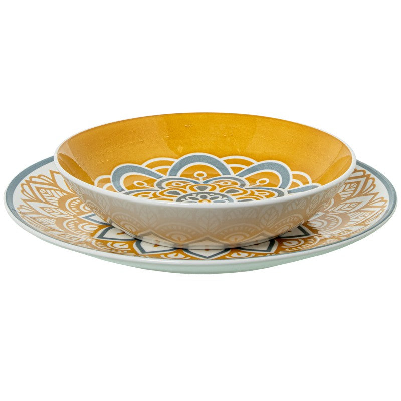 Tazón de porcelana con diseño mandala amarillo sobre plato a juego, vista frontal sobre fondo blanco