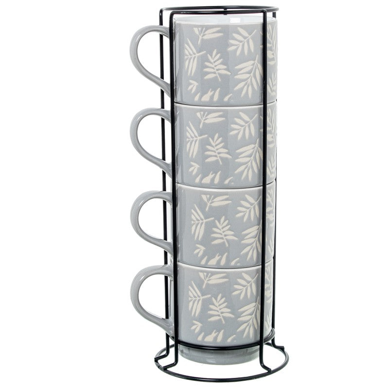 Set de 4 mugs de cerámica azul con diseño de hojas blancas, apilados en soporte metálico negro