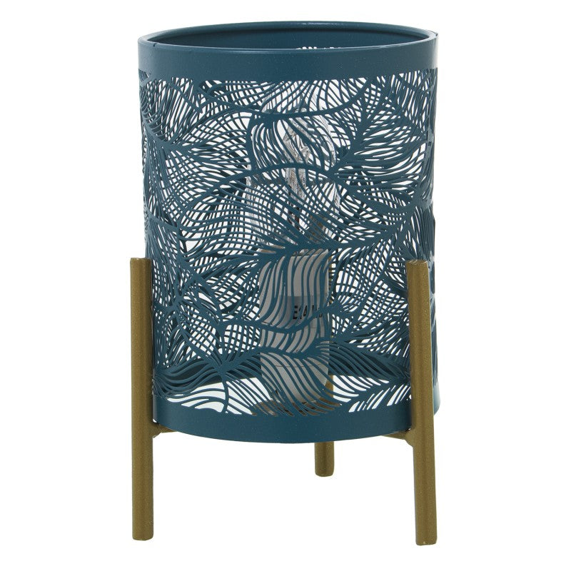 Lámpara de sobremesa cilíndrica de metal azul petróleo con calado de hojas y patas de madera tono dorado
