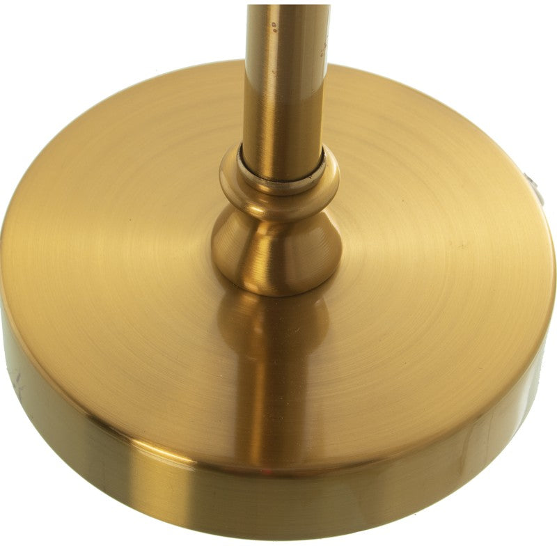 Primer plano de la base circular de metal bronce con acabado brillante y el pie torneado de la lámpara
