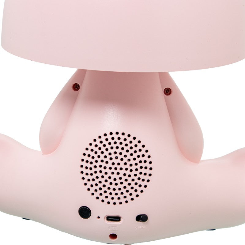 Detalle trasero de la lámpara conejo rosa mostrando el altavoz Bluetooth, puerto USB-C e interruptor
