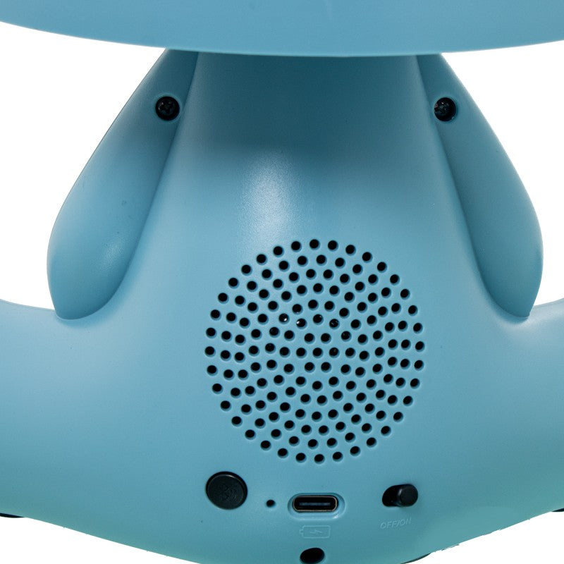 Detalle trasero de la lámpara conejo azul mostrando el altavoz Bluetooth, puerto USB-C e interruptor