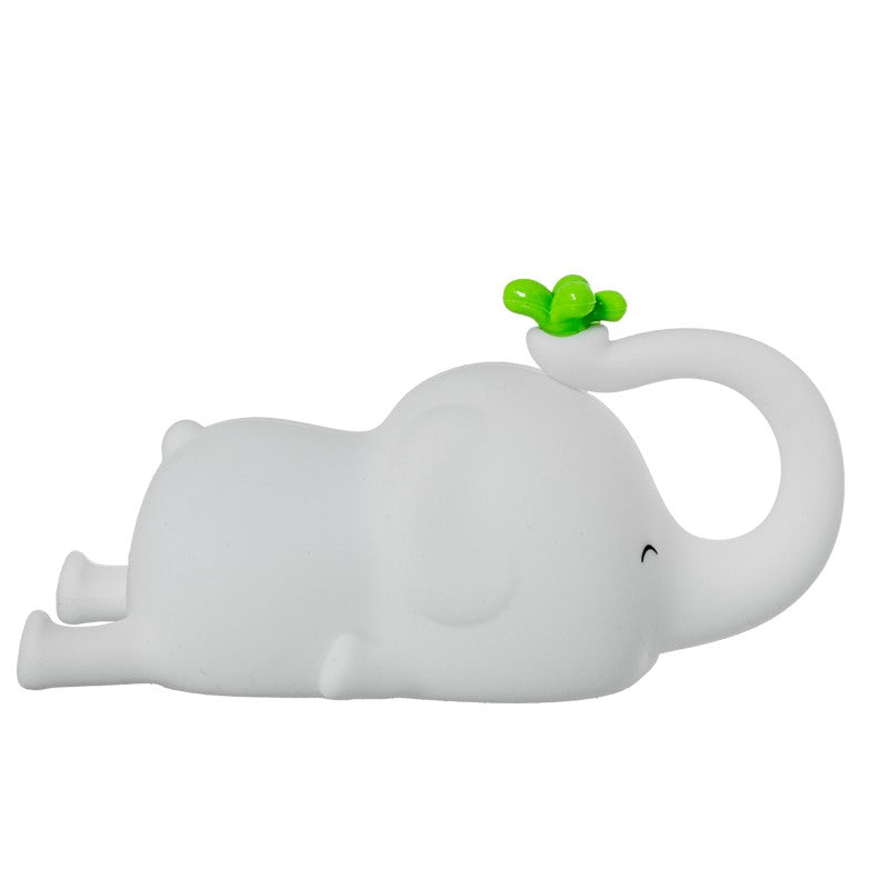 Vista lateral de la luz nocturna de silicona con forma de elefante blanco