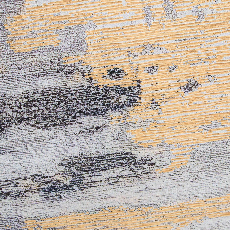 Detalle de la textura difuminada en gris y oro del cuadro